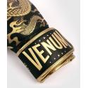 Venum Dragon's Flight boxing gloves black / gold